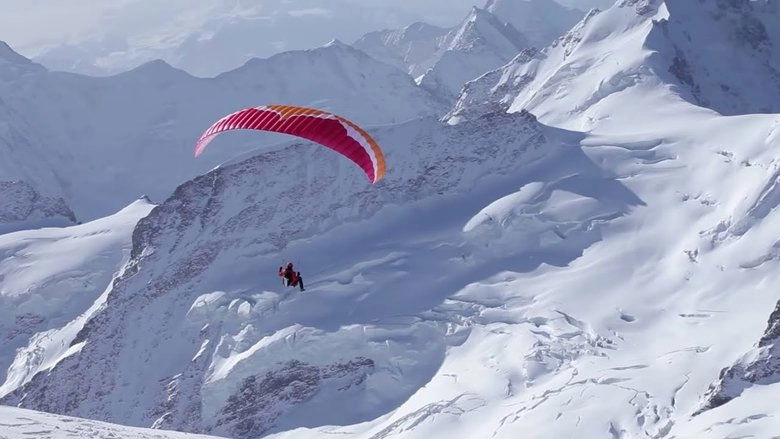 Ueli Steck - Paraglides Between Mountains In The Swiss Alps (2013)